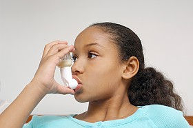 Girl with an asthma inhaler